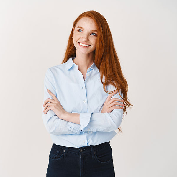 Patient Information Woman with Red Hair Smiling Indoors